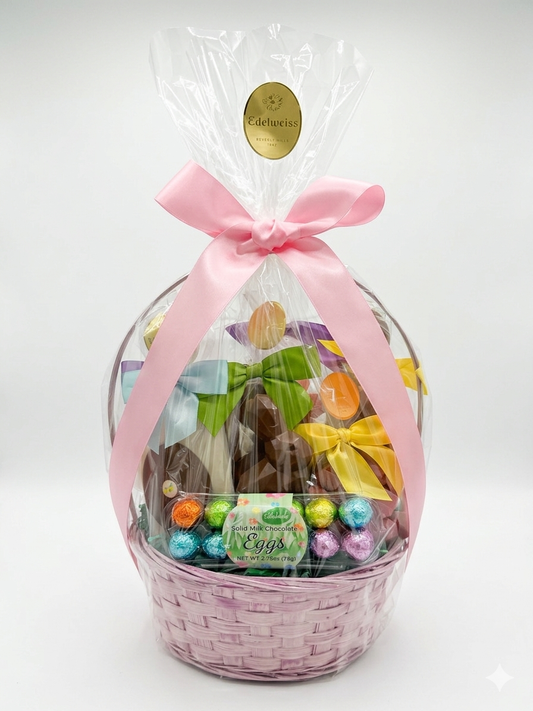 Easter gift basket with pink ribbon and colorful Easter eggs on a white background. Made in Beverly Hills and Los Angeles. Gourmet Chocolates.